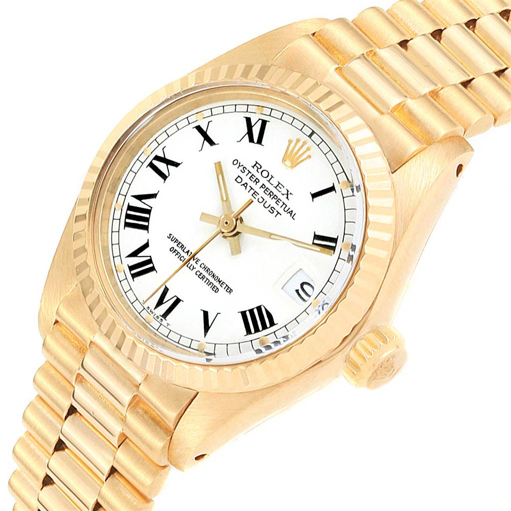 The Rolex Datejust 6917 Women's Yellow Gold White Dial 6917 Women's Yellow Gold White Dial watch is shown at an angled close-up, displaying the face, bezel, crown, and part of the bracelet.