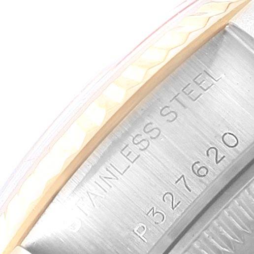 The image shows a close-up of the casing and bezel edge on a Rolex Datejust 79173 Women's Steel and Gold (two tone) White Dial 79173 Women's Steel and Gold (two tone) White Dial watch with "STAINLESS STEEL" and a serial number engraved.