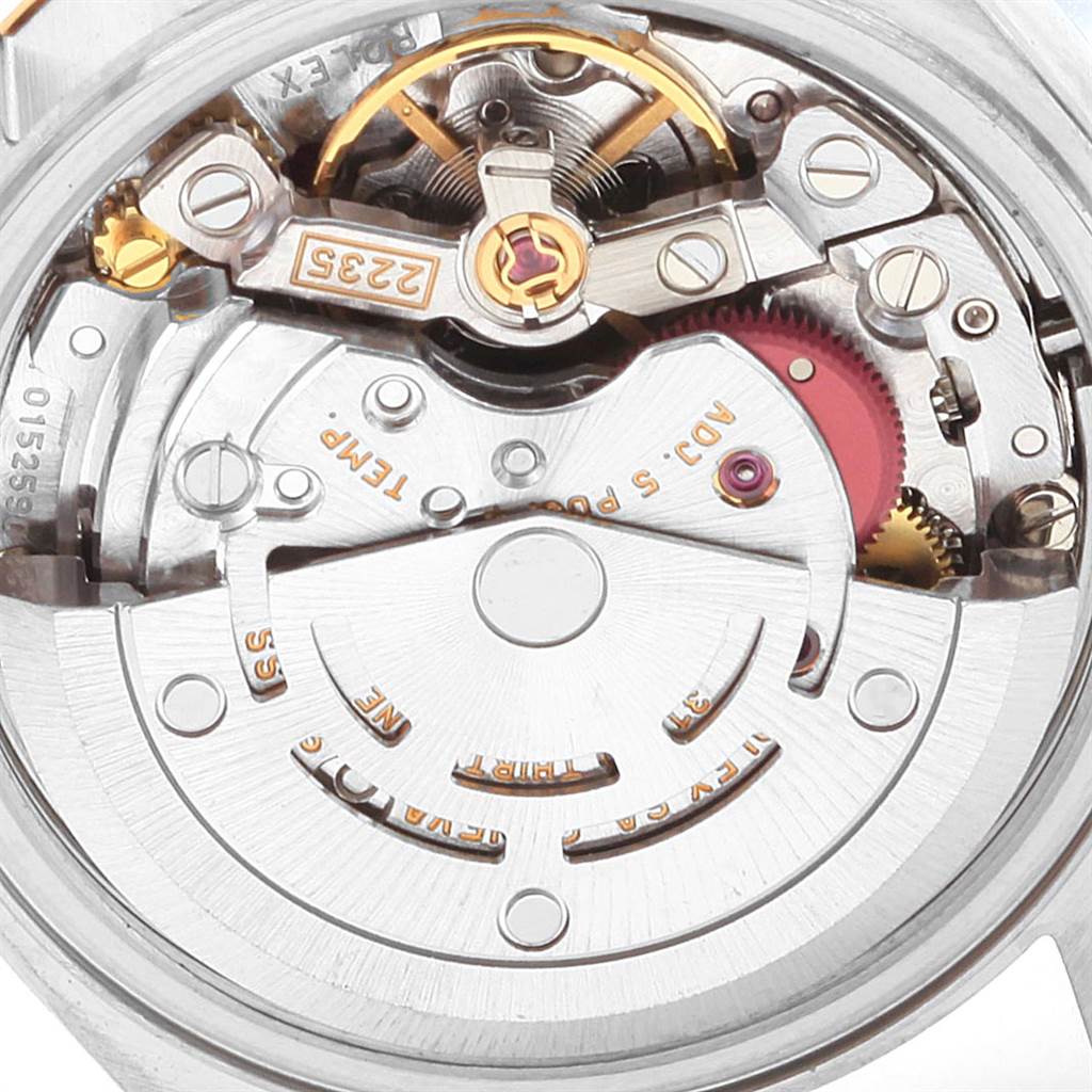 This image shows a close-up view of the movement and inner mechanism of a Rolex Datejust 79173 Women's Steel and Gold (two tone) White Dial 79173 Women's Steel and Gold (two tone) White Dial watch.