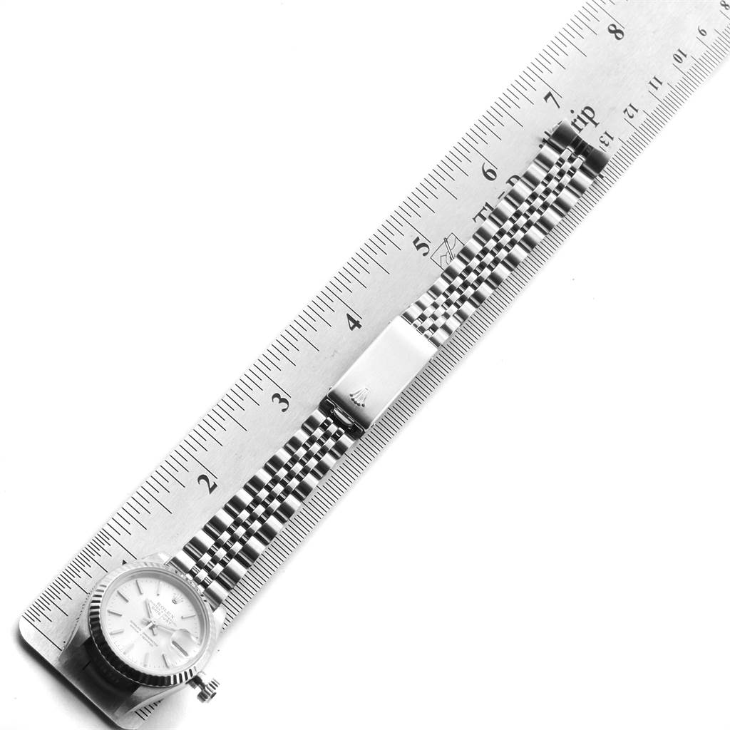 The image shows the bezel, dial, and jubilee bracelet of a Rolex Datejust 69174 Women's Stainless Steel Silver Dial 69174 Women's Stainless Steel Silver Dial watch, aligned alongside a ruler for measurement.