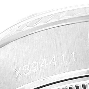 This image shows a close-up of the case back of a Rolex Datejust 69174 Women
s Stainless Steel White Dial 69174 Women
s Stainless Steel White Dial watch, with the serial number inscribed.