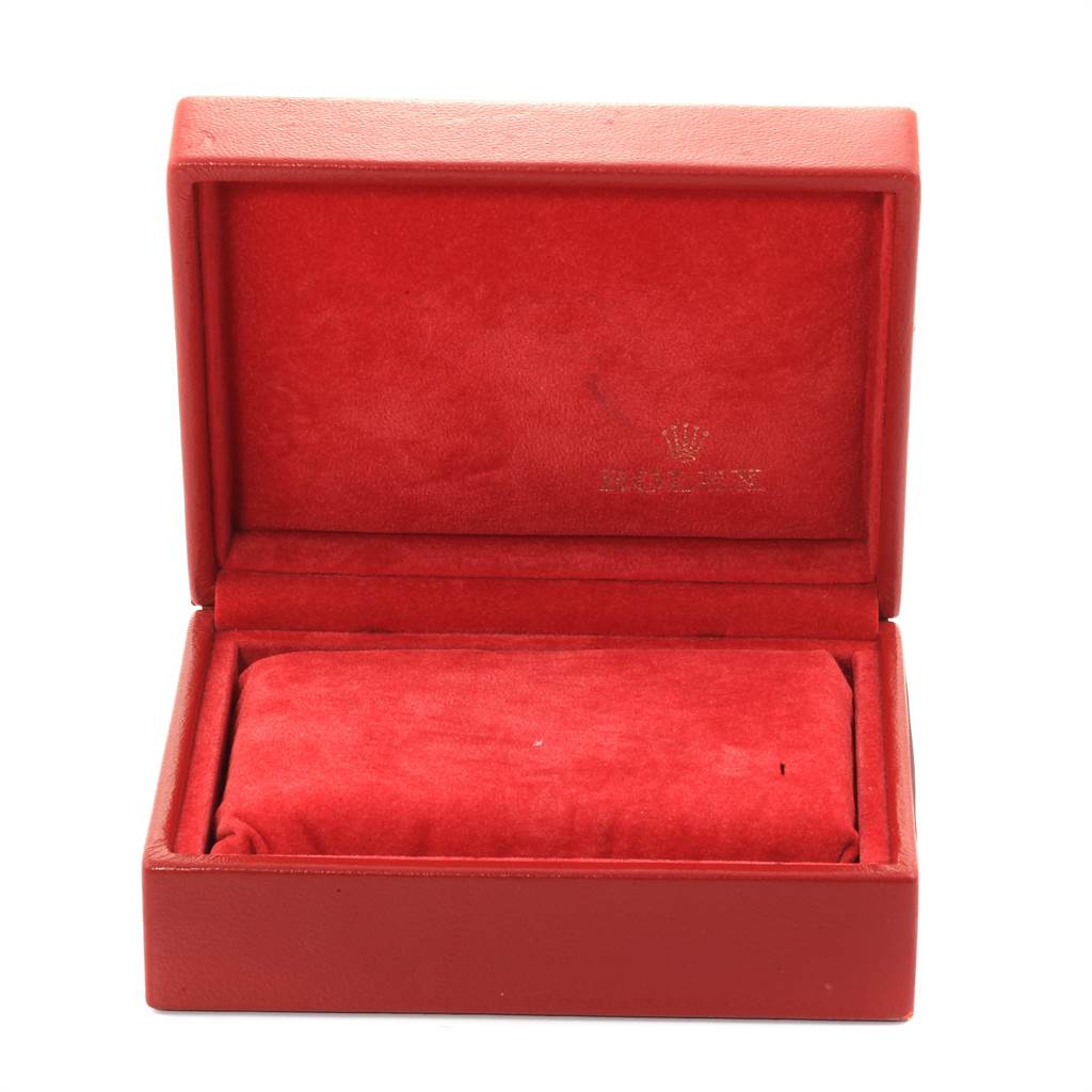 This is a red, open Rolex Datejust 69173 Women's Steel and Gold (two tone) Blue Dial 69173 Women's Steel and Gold (two tone) Blue Dial watch box, showing the interior and padded cushion.
