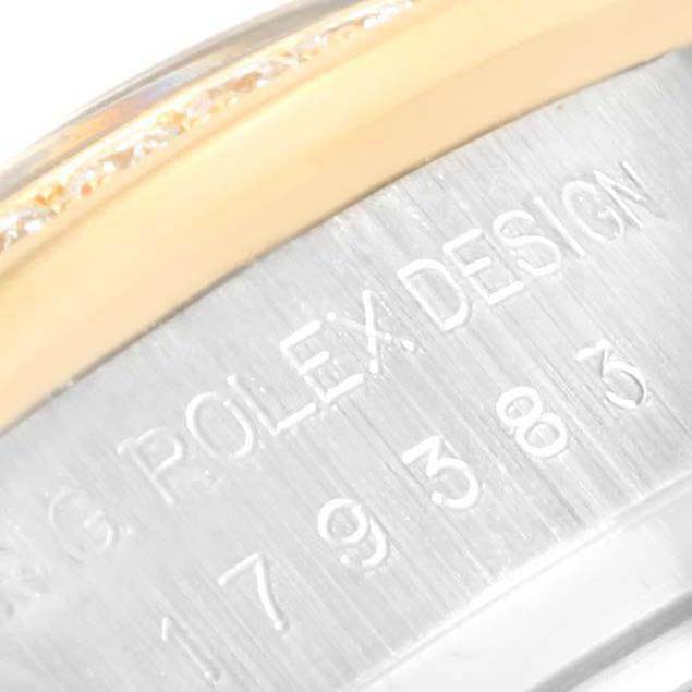 The image shows a close-up of the casing with engraved text on a Rolex Datejust 179383 Women's Steel and Gold (two tone) Champagne Dial 179383 Women's Steel and Gold (two tone) Champagne Dial model watch.