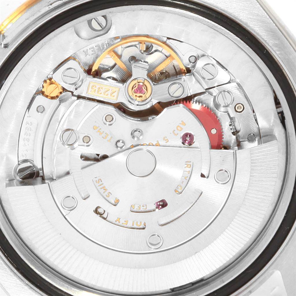 This is a close-up view showing the intricate movement mechanism of a Rolex Datejust 178273 Women
s Steel and Gold (two tone) Champagne Dial 178273 Women
s Steel and Gold (two tone) Champagne Dial watch.