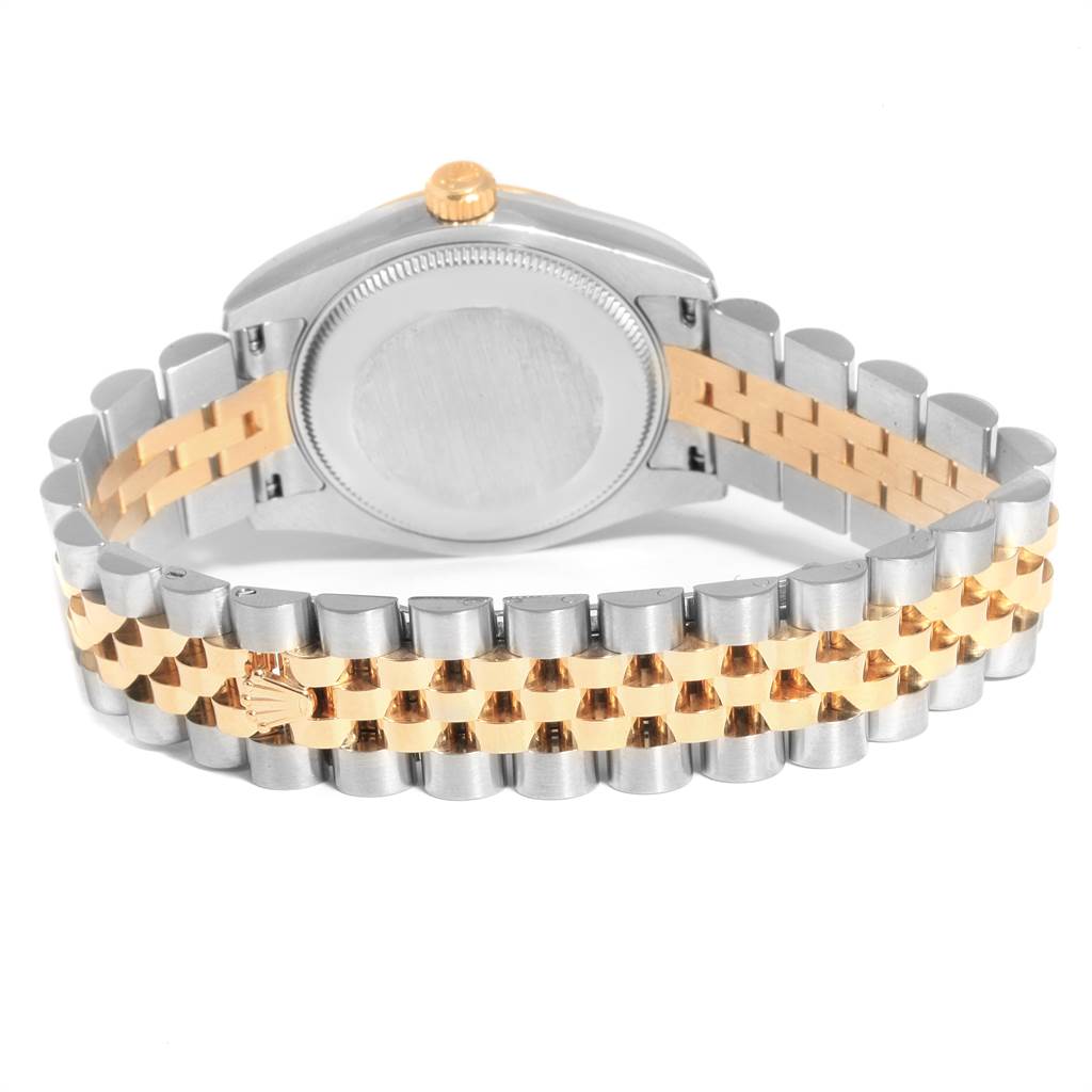 The image shows the back view of the Rolex Datejust 178273 Women
s Steel and Gold (two tone) Champagne Dial 178273 Women
s Steel and Gold (two tone) Champagne Dial watch, highlighting its two-tone bracelet and case back.