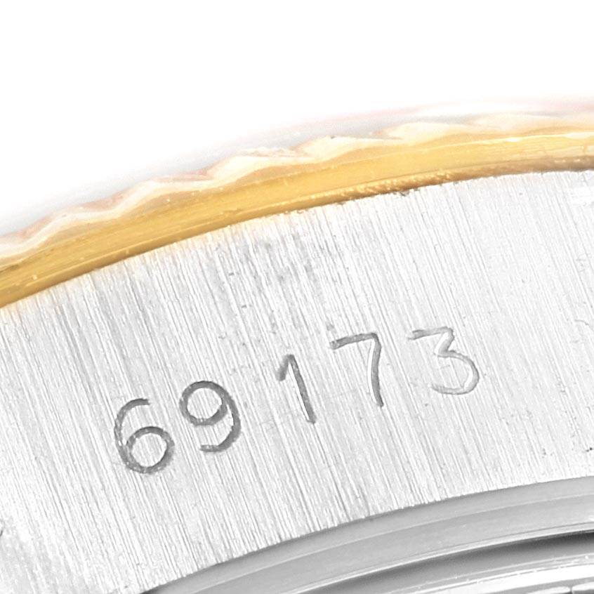 This close-up image shows the model number "69173" engraved on the side of a Rolex Datejust 69173 Women's Stainless Steel White Dial 69173 Women's Stainless Steel White Dial watch case.