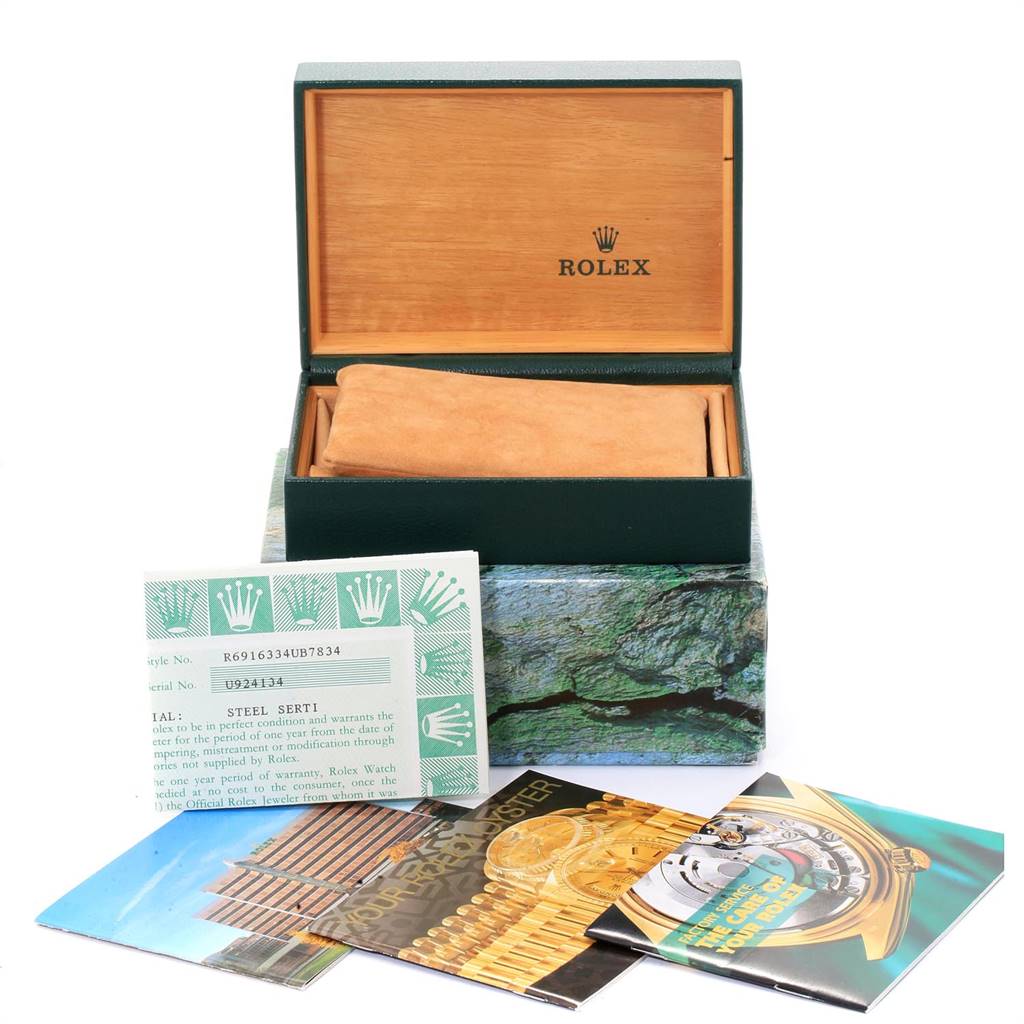 The image shows a Rolex Datejust 69163 Women's Stainless Steel Grey Dial 69163 Women's Stainless Steel Grey Dial watch box, with warranty cards and booklets displayed in front.