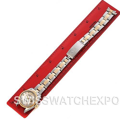 This Rolex Datejust 69163 Women's Stainless Steel Mother of Pearl Dial 69163 Women's Stainless Steel Mother of Pearl Dial watch is shown from a top-down angle, displaying its full bracelet and face, resting on a ruler.