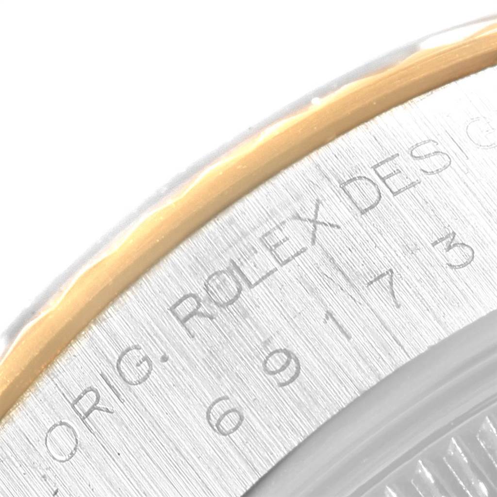 This close-up image shows part of the outer case and the engraved details of the Rolex Datejust 69173 Women's Stainless Steel Beige Dial 69173 Women's Stainless Steel Beige Dial watch model.
