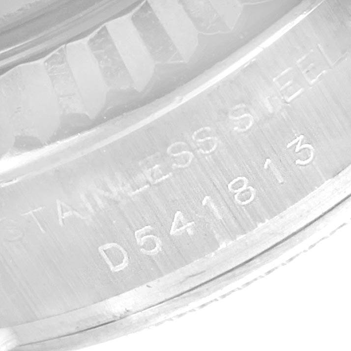 This image shows a close-up of the stainless steel casing and serial number of a Rolex Datejust 179174 Women
s Stainless Steel White Dial 179174 Women
s Stainless Steel White Dial watch.