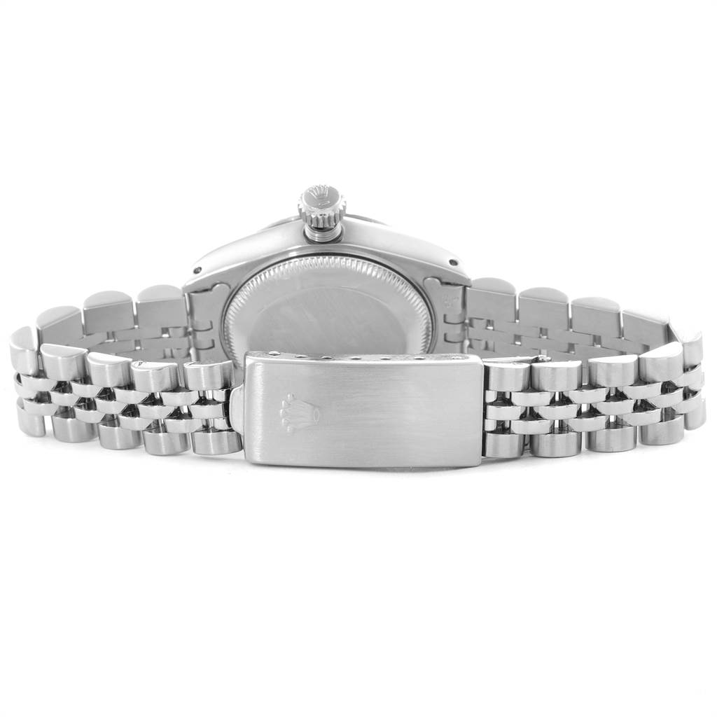 The image shows the back view of a Rolex Datejust 69174 Women
s Stainless Steel Silver Dial 69174 Women
s Stainless Steel Silver Dial watch, highlighting its clasp, case back, crown, and bracelet.