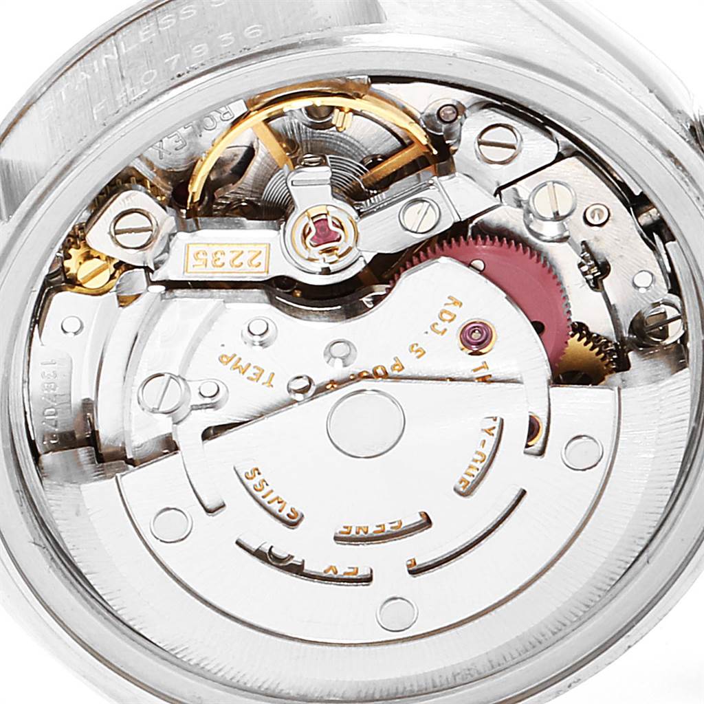 The image shows a close-up view of the movement mechanism inside a Rolex Datejust 79174 Women
s Stainless Steel Black Dial 79174 Women
s Stainless Steel Black Dial watch.