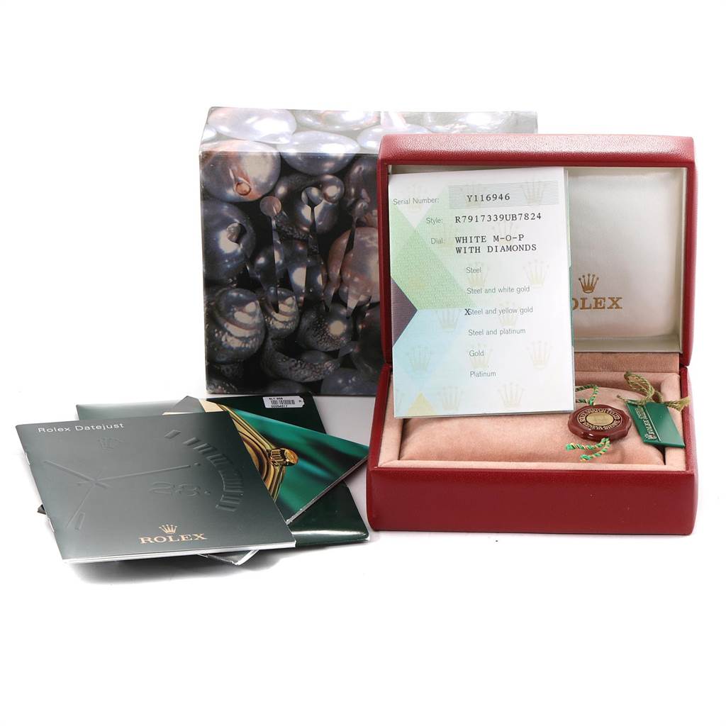 The image shows a Rolex Datejust 79173 Women's Stainless Steel Mother of Pearl Dial 79173 Women's Stainless Steel Mother of Pearl Dial watch box with documents and tags included, partially displaying the inner watch cushion.