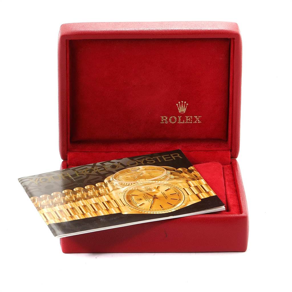 The image shows an open Rolex watch box with a brochure for the Datejust model inside.