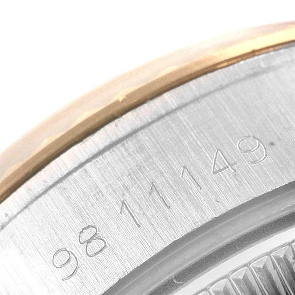 This close-up image shows the serial number engraving on the side of a Rolex Datejust 69173 Women's Stainless Steel Champagne Dial 69173 Women's Stainless Steel Champagne Dial watch.