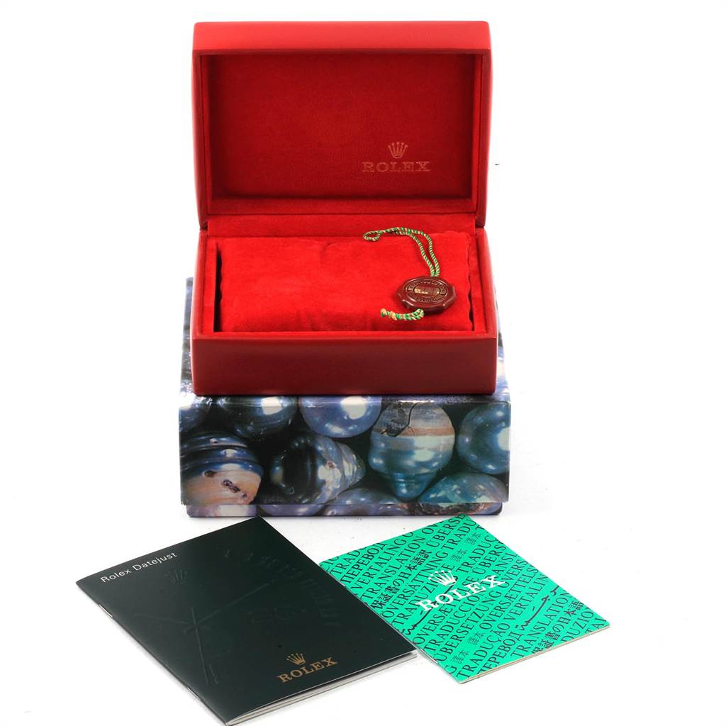 The image shows an open Rolex Datejust 69173 Women's Stainless Steel Champagne Dial 69173 Women's Stainless Steel Champagne Dial box with paperwork and a tag, viewed from a front angle.