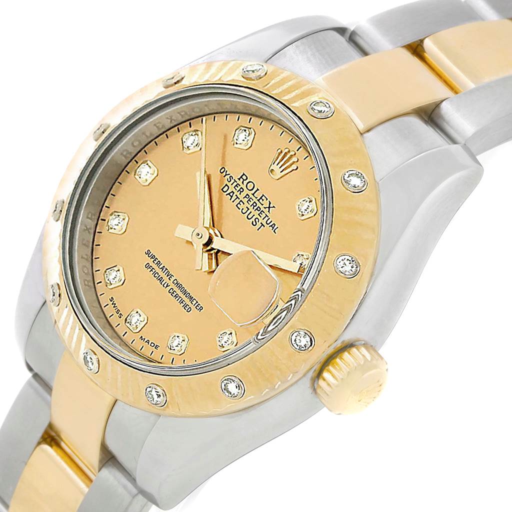 This image shows a close-up of the Rolex Datejust 179313 Women's Stainless Steel Champagne Dial 179313 Women's Stainless Steel Champagne Dial watch's face, bezel, crown, and part of its bracelet.