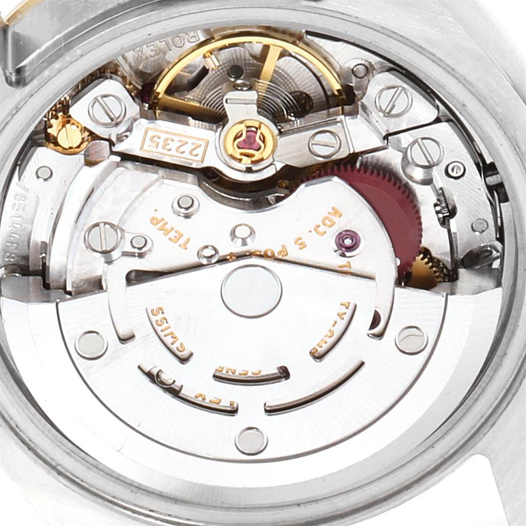 This is a close-up view of the internal mechanical movement of a Rolex Datejust 179173 Women's Steel and Gold (two tone) Mother of Pearl Dial 179173 Women's Steel and Gold (two tone) Mother of Pearl Dial watch.