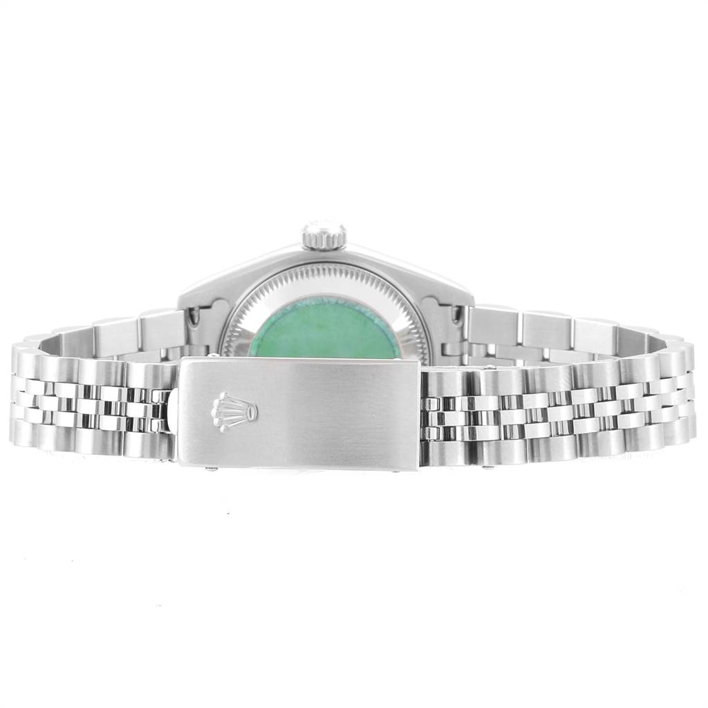 This image shows the back of a Rolex Datejust 79174 Women
s Stainless Steel Pink Dial 79174 Women
s Stainless Steel Pink Dial watch and its bracelet clasp, with the case back and crown visible.