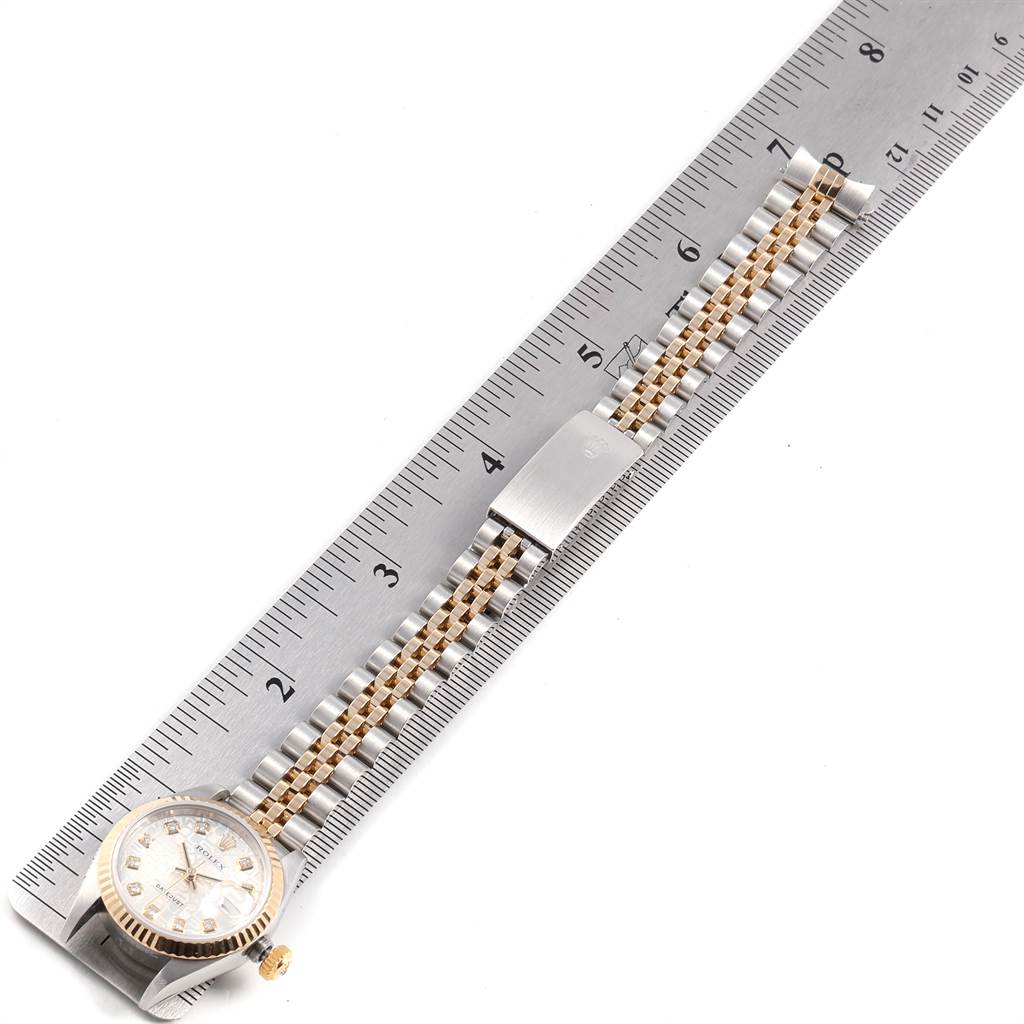 The image shows the face and bracelet of a Rolex Datejust 79173 Women's Stainless Steel Silver Dial 79173 Women's Stainless Steel Silver Dial watch, alongside a ruler for size reference.