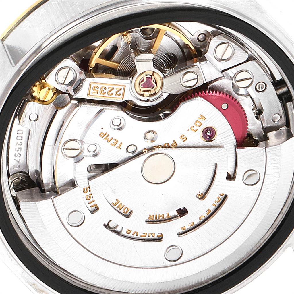 The image shows an interior view of the Rolex Datejust 79173 Women's Stainless Steel Silver Dial 79173 Women's Stainless Steel Silver Dial movement, highlighting gears, the balance wheel, and rotor.