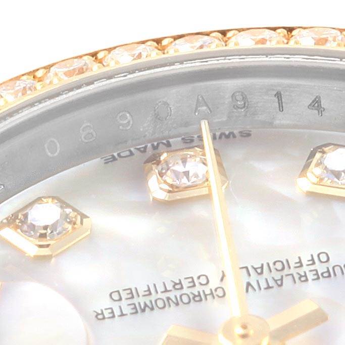 Close-up of the Rolex Datejust 179383 Women's Steel and Gold (two tone) Mother of Pearl Dial 179383 Women's Steel and Gold (two tone) Mother of Pearl Dial watch face, showing details of the dial, diamonds, and model number engraving.