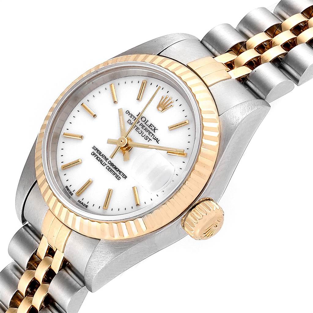 The image shows a close-up angle of a Rolex Datejust 79173 Women
s Steel and Gold (two tone) White Dial 79173 Women
s Steel and Gold (two tone) White Dial model watch, featuring its dial, crown, and two-tone bracelet.