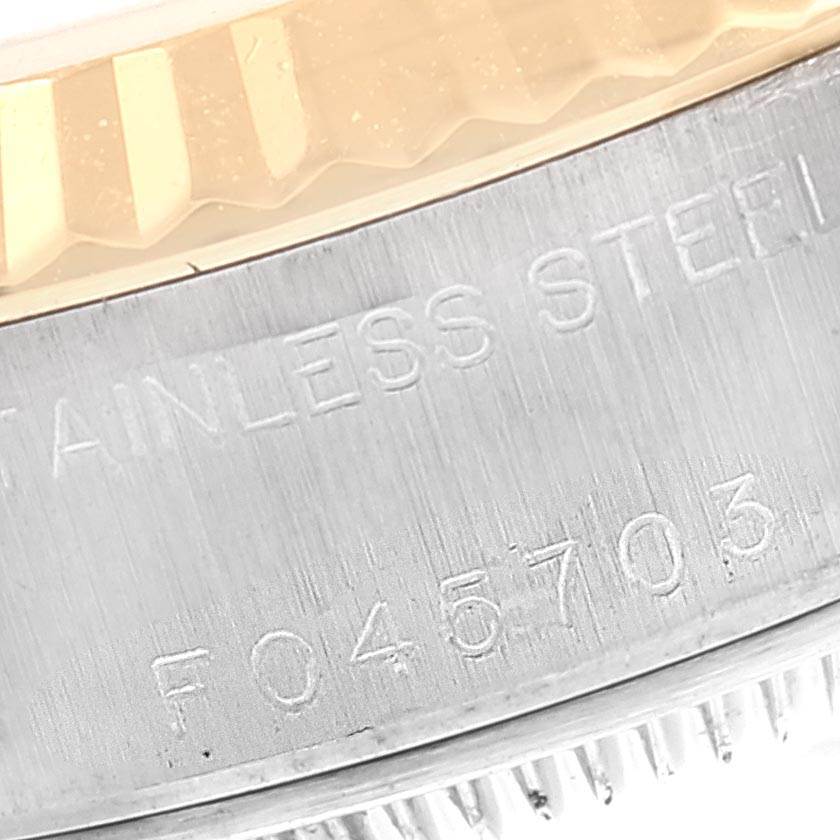 This close-up image shows the side view of the bezel and the engravings on the stainless steel case of a Rolex Datejust 79173 Women
s Steel and Gold (two tone) White Dial 79173 Women
s Steel and Gold (two tone) White Dial watch.