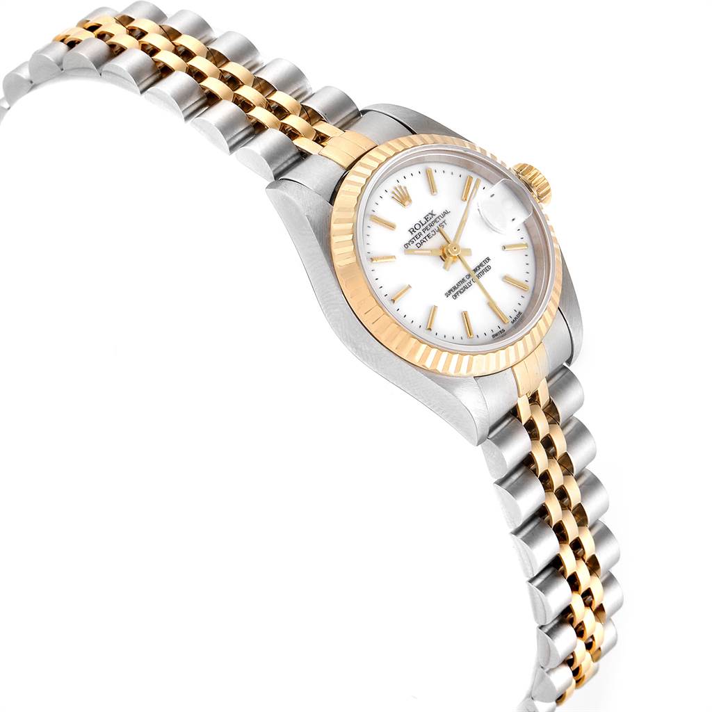 This image shows a Rolex Datejust 79173 Women
s Steel and Gold (two tone) White Dial 79173 Women
s Steel and Gold (two tone) White Dial watch at an oblique angle, highlighting the dial, bezel, and two-tone bracelet.