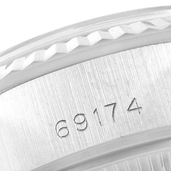 This close-up image shows the engraved model number "69174" on the case of a Rolex Datejust 69174 Stainless Steel Silver Dial 69174 Stainless Steel Silver Dial watch.