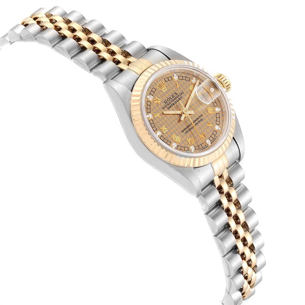 The image shows a Rolex Datejust 69173 Women's Stainless Steel Champagne Dial 69173 Women's Stainless Steel Champagne Dial watch at an angled view, revealing its dial, bezel, and two-tone metal bracelet.
