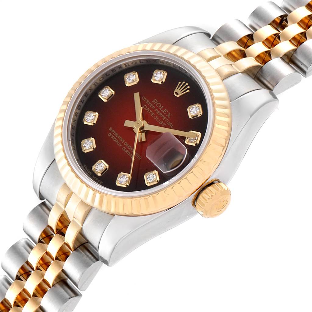 This Rolex Datejust 179173 Women
s Steel and Gold (two tone) Red Dial 179173 Women
s Steel and Gold (two tone) Red Dial watch is shown at a slight angle displaying its dial, bezel, crown, and bracelet.
