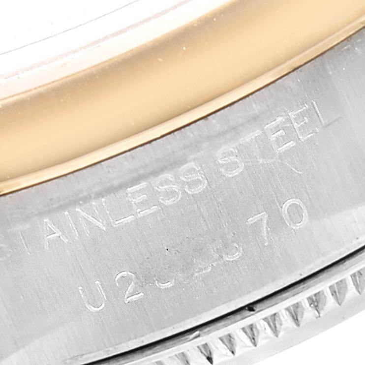 This image shows a close-up of the side of a Rolex Datejust 69163 Women's Stainless Steel White Dial 69163 Women's Stainless Steel White Dial watch case, highlighting the stainless steel material and serial number.
