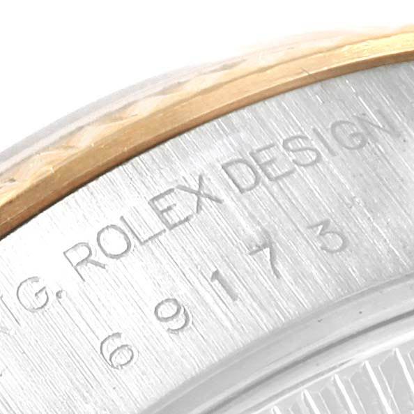 This close-up image shows the side engraving on a Rolex Datejust 69173 Women's Stainless Steel Silver Dial 69173 Women's Stainless Steel Silver Dial watch case.