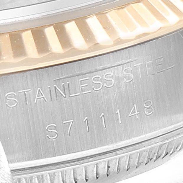 This image shows a close-up of the case side and part of the bezel of a Rolex Datejust 69173 Women's Stainless Steel Silver Dial 69173 Women's Stainless Steel Silver Dial watch, highlighting the stainless steel material and serial number.