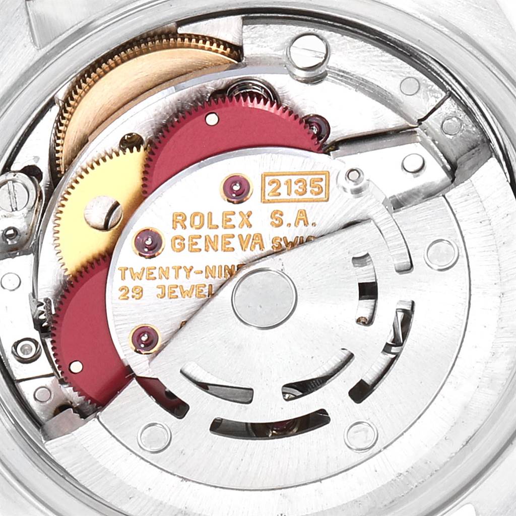This close-up image shows the internal mechanism of a Rolex Datejust 69173 Women's Stainless Steel Silver Dial 69173 Women's Stainless Steel Silver Dial model watch, highlighting the gears and movement components.