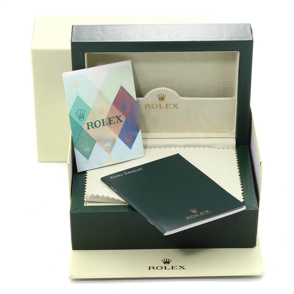 The image shows packaging and manuals for the Rolex Datejust 179173 Women
s Steel and Gold (two tone) Blue Dial 179173 Women
s Steel and Gold (two tone) Blue Dial model, viewed from the top angle.