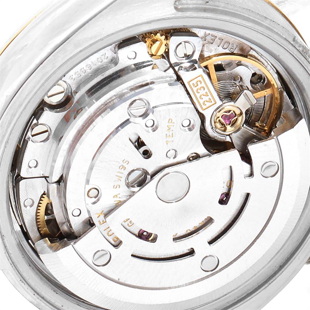 The image shows a close-up view of the mechanical movement and internal components of a Rolex Datejust 179173 Women
s Steel and Gold (two tone) Blue Dial 179173 Women
s Steel and Gold (two tone) Blue Dial watch.
