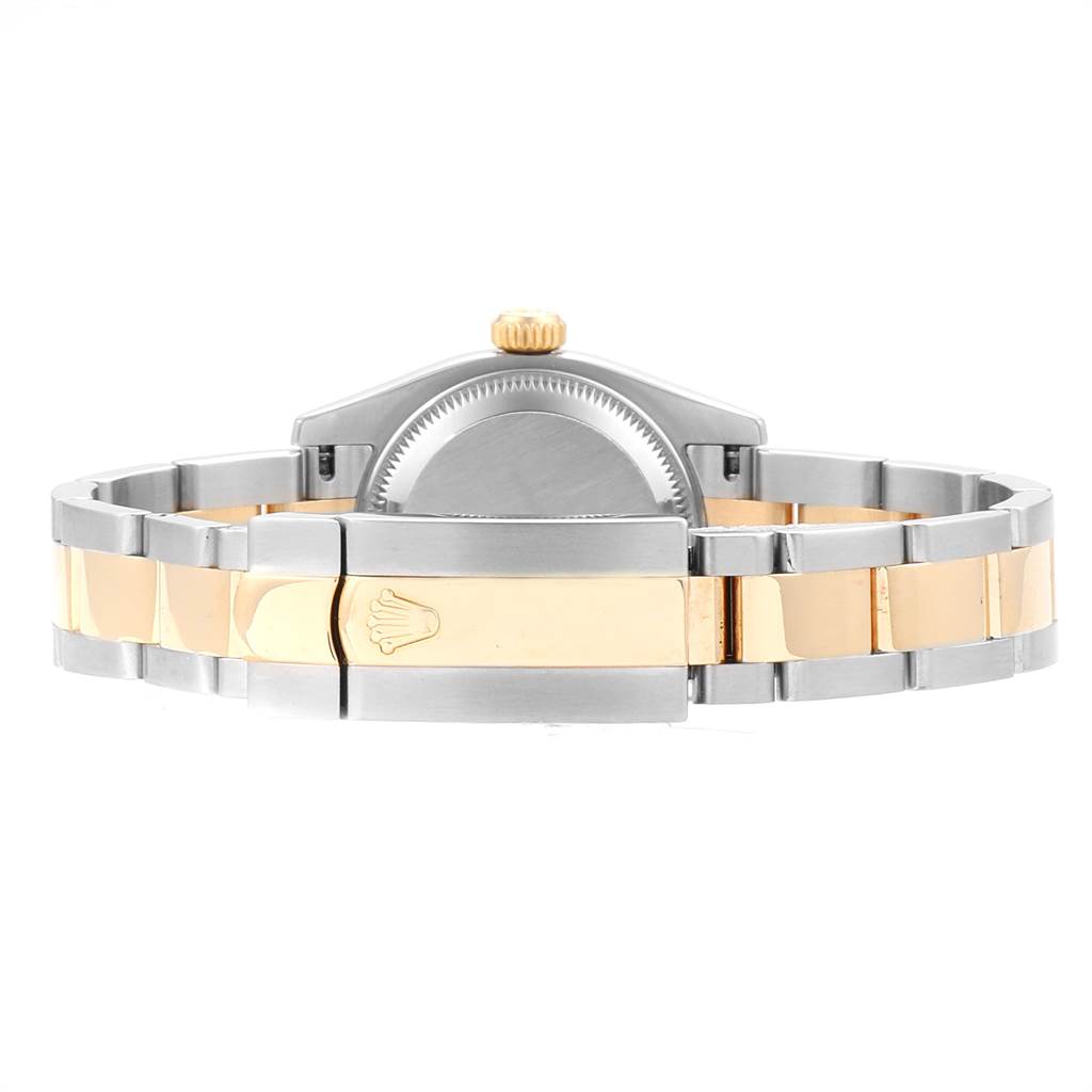 The image shows the backside and clasp of a Rolex Datejust 179173 Women's Steel and Gold (two tone) White Dial 179173 Women's Steel and Gold (two tone) White Dial watch, highlighting its two-tone metal bracelet.