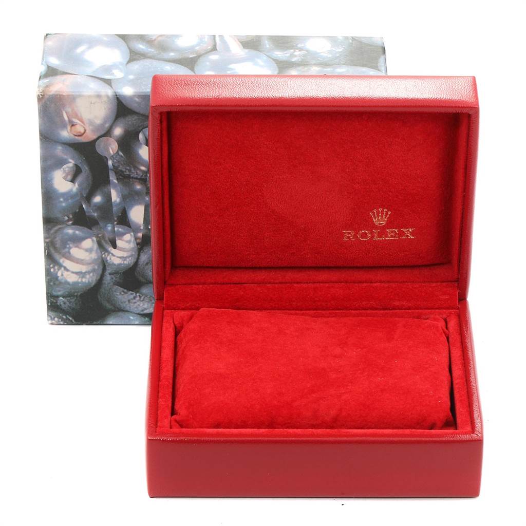 The image shows an open red Rolex watch box, designed for the Datejust model, with a padded insert and exterior decorative packaging.