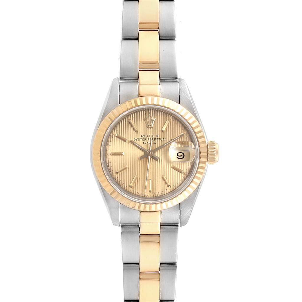 This Rolex Datejust 69173 Women
s Stainless Steel Champagne Dial 69173 Women
s Stainless Steel Champagne Dial watch is shown from a top-down angle, highlighting its two-tone bracelet, gold fluted bezel, and champagne dial.