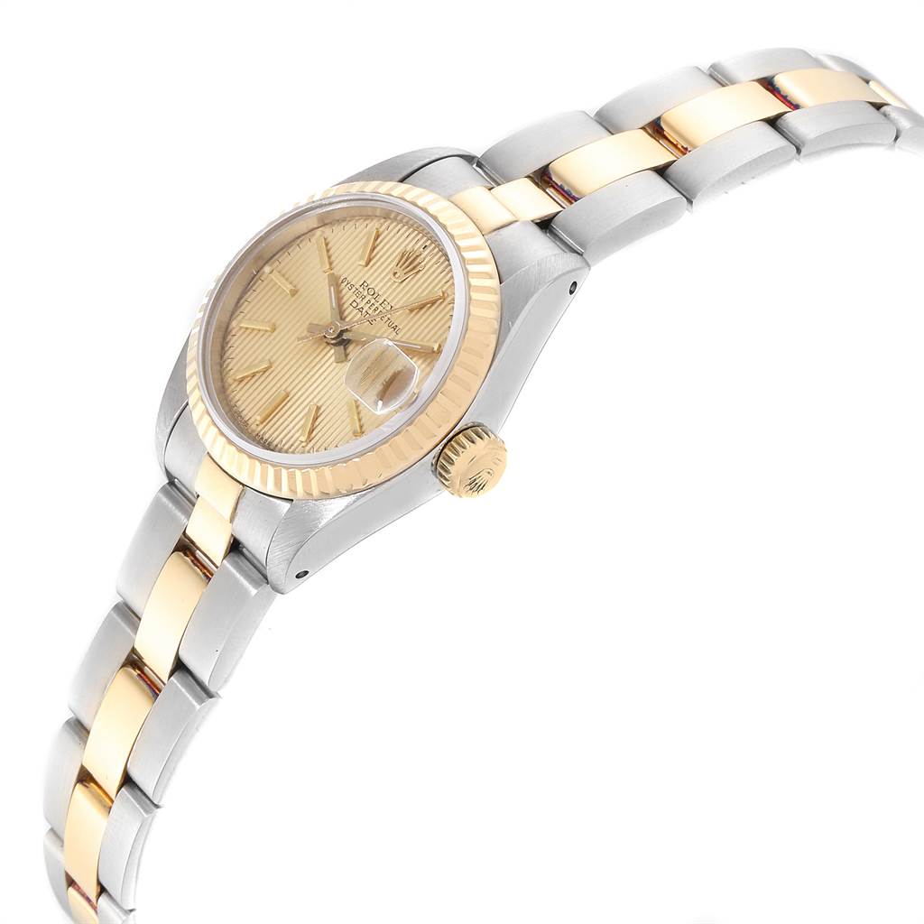 The image shows a Rolex Datejust 69173 Women
s Stainless Steel Champagne Dial 69173 Women
s Stainless Steel Champagne Dial watch angled to display the dial, bezel, crown, and part of the bracelet.