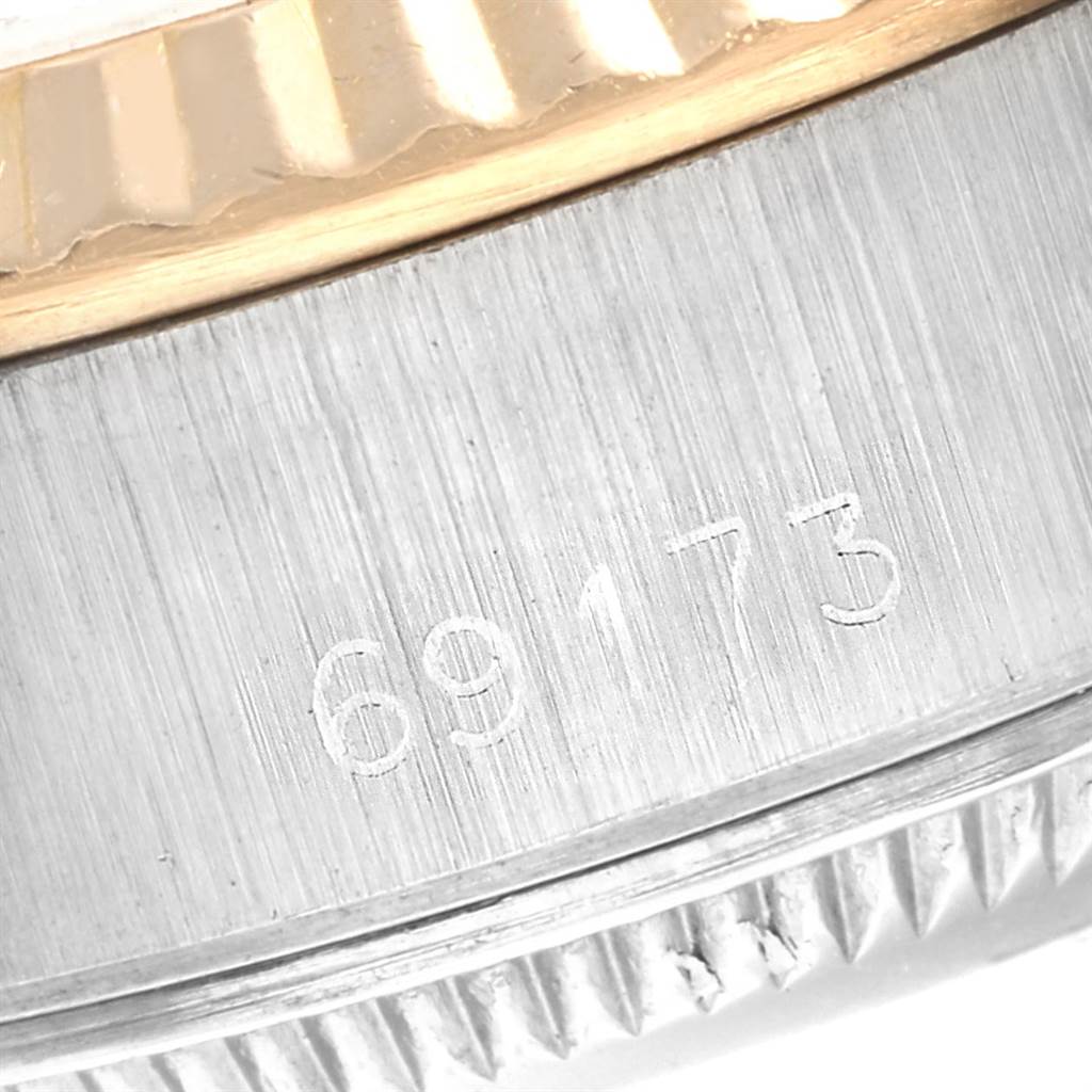This image shows a close-up of the case and screw-down bezel of the Rolex Datejust 69173 Women
s Stainless Steel White Dial 69173 Women
s Stainless Steel White Dial model, displaying the serial number "69173".