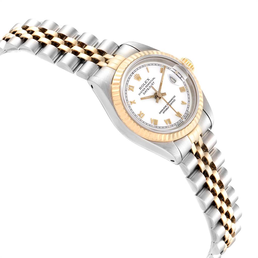 This image shows a Rolex Datejust 69173 Women
s Stainless Steel White Dial 69173 Women
s Stainless Steel White Dial watch from an angled side view, featuring its gold and stainless steel Jubilee bracelet and fluted bezel.