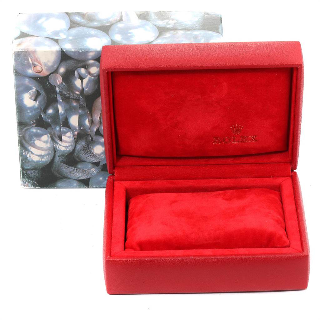 This image shows an empty Rolex Datejust 69173 Women
s Stainless Steel White Dial 69173 Women
s Stainless Steel White Dial watch case with the lid open, revealing a red interior and the Rolex logo.