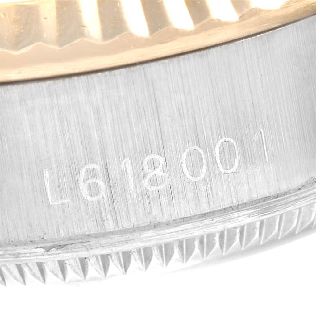 The image shows the engraved reference number on the side of the case of a Rolex Datejust 69173 Women
s Stainless Steel White Dial 69173 Women
s Stainless Steel White Dial watch.