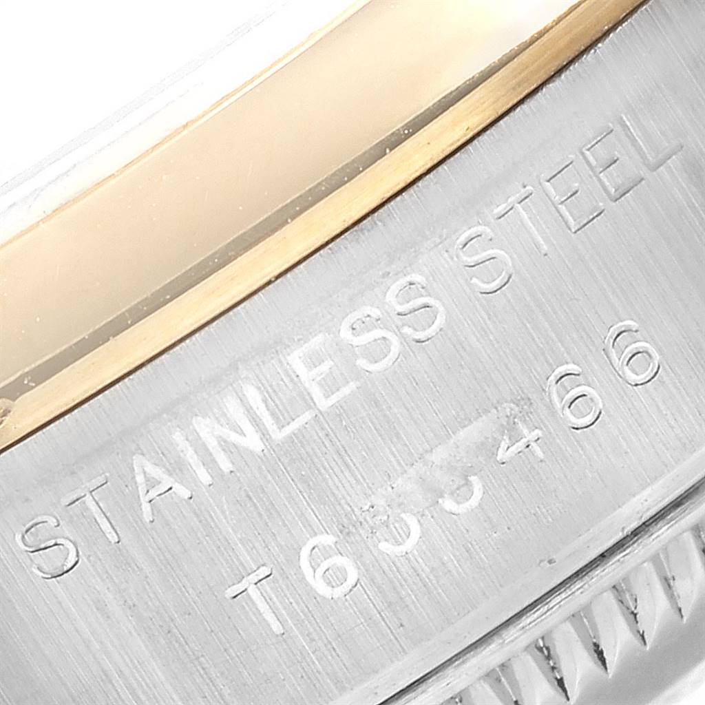 This close-up image shows the stainless steel and gold bezel engraving of a Rolex Datejust 69163 Women's Stainless Steel White Dial 69163 Women's Stainless Steel White Dial watch.
