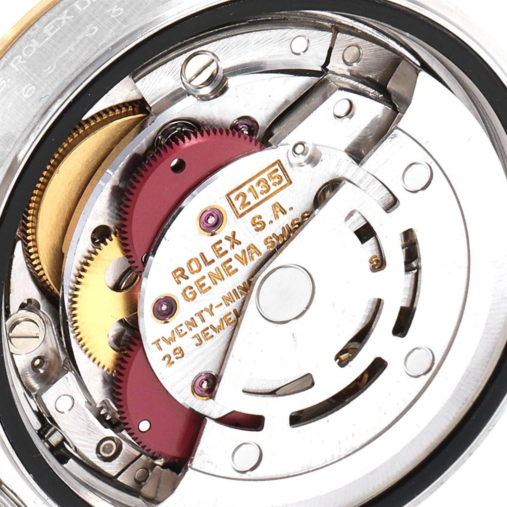 This image shows a close-up of the movement inside a Rolex Datejust 69163 Women's Stainless Steel White Dial 69163 Women's Stainless Steel White Dial watch, highlighting the gears and intricate details.