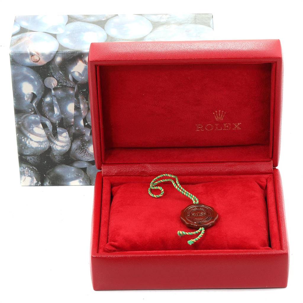 The image shows the open box of a Rolex Datejust 69163 Women's Stainless Steel White Dial 69163 Women's Stainless Steel White Dial watch with a tag inside, but the watch itself is not visible.