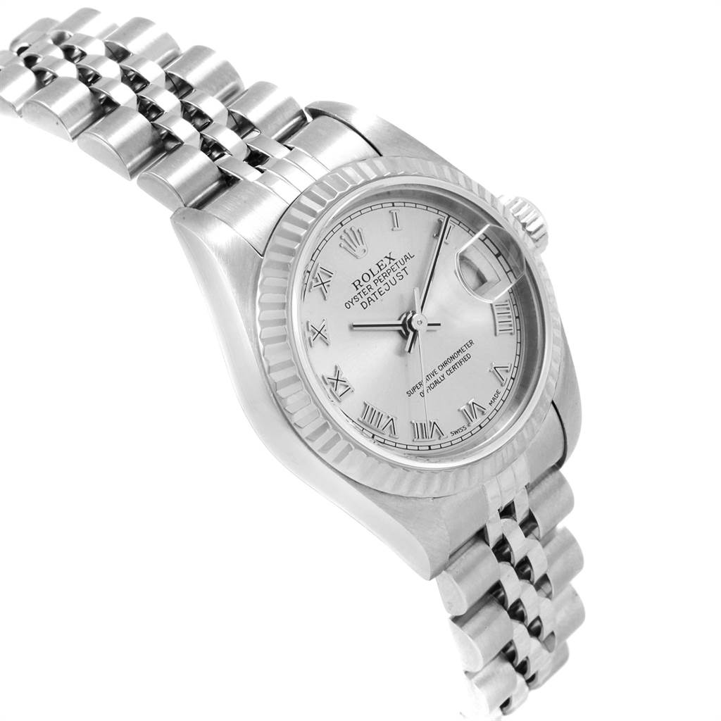 The image shows a Rolex Datejust 79174 Women
s Stainless Steel Silver Dial 79174 Women
s Stainless Steel Silver Dial watch at an angled side view, highlighting its silver dial, bezel, and bracelet.